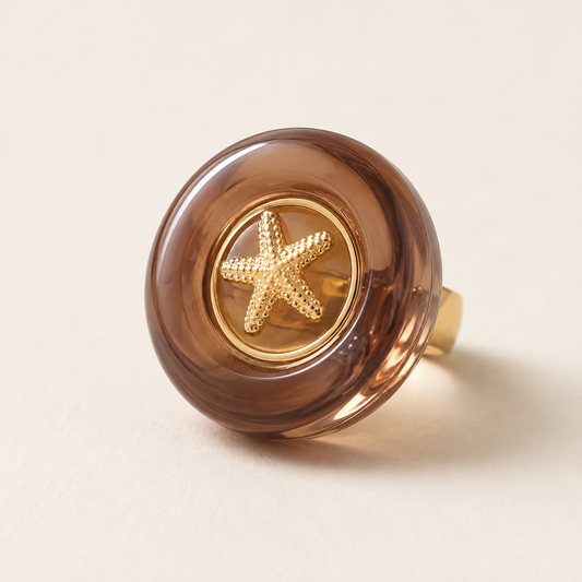 Acrylic Starfish Ring on a luxury ivory studio background