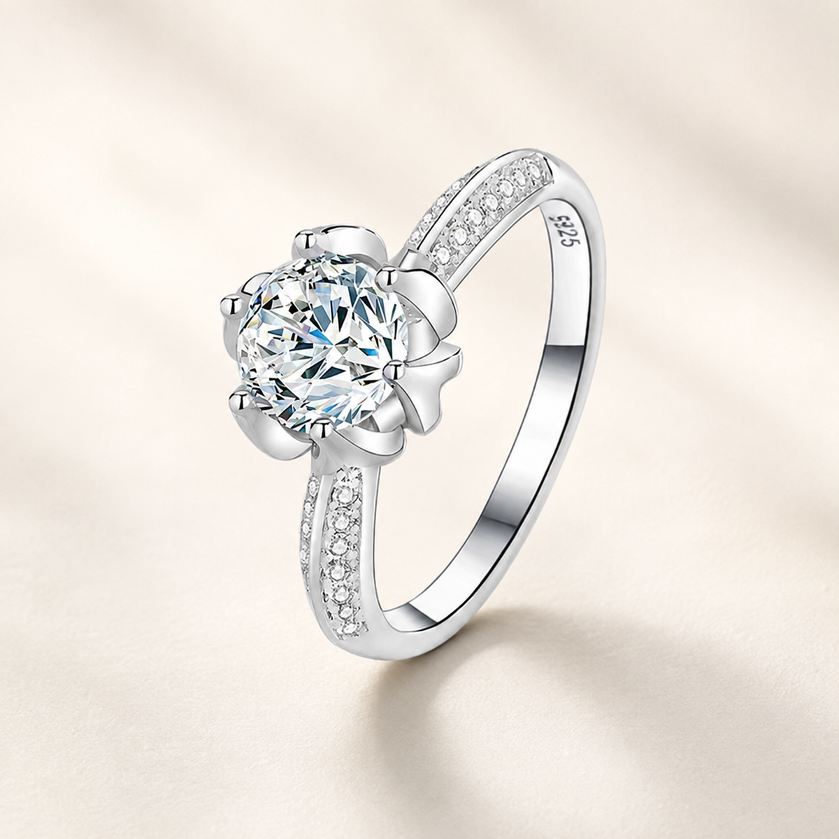 Anemone Moissanite Silver Ring on a luxury ivory studio background