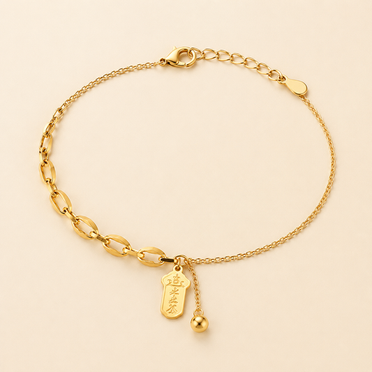 Best Fortune asymmetrical gold anklet with lucky talisman pendant and bead tassel on luxury ivory background