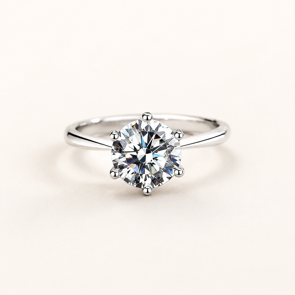Classic Six-Prong Silver Ring on a luxury ivory studio background