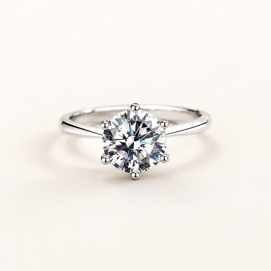 Classic Six-Prong Silver Ring on a luxury ivory studio background
