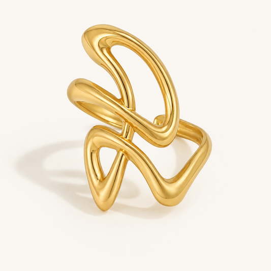 Elliverse gold adjustable wave ring on a luxury white studio background