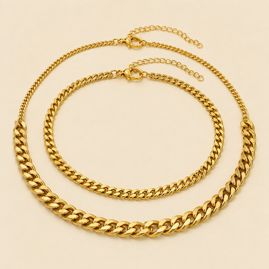 Three gold Cuban chain anklet styles in fine, medium and bold widths on warm ivory