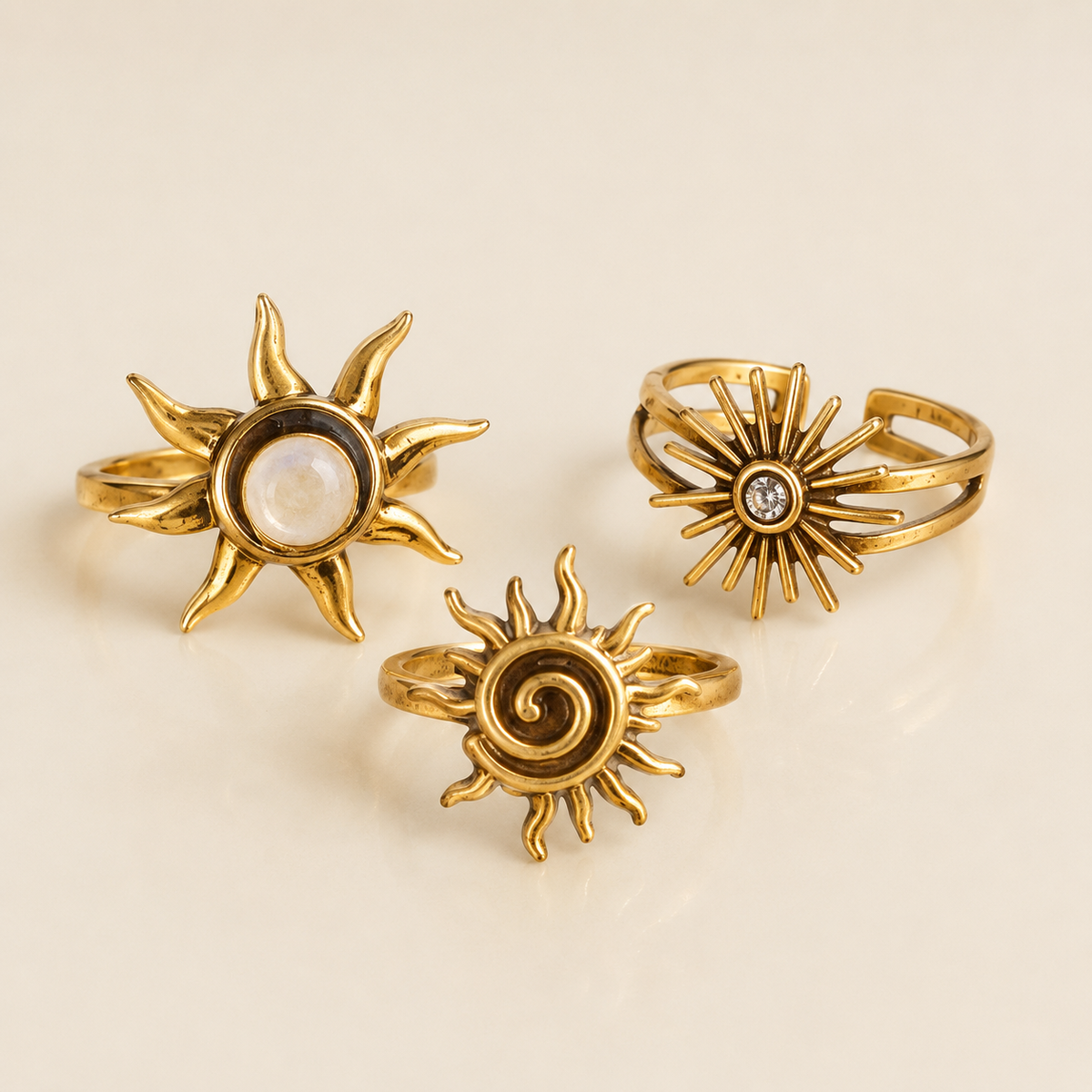 Golden Sun Ring collection on a luxury ivory studio background