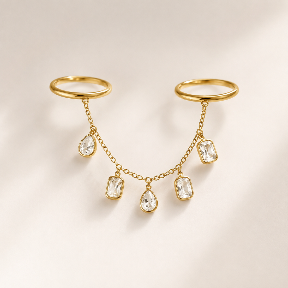 Tassel Chain Ring on a luxury ivory studio background
