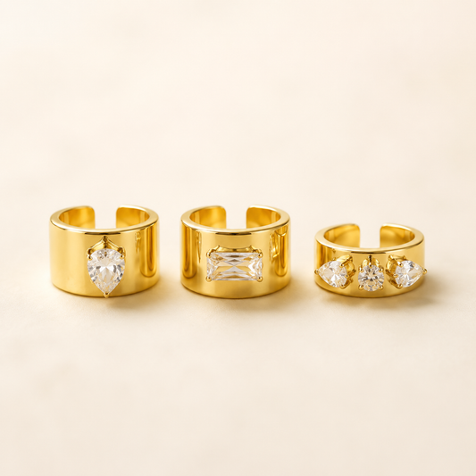 Wide Zircon Open Ring collection in gold on luxury ivory background