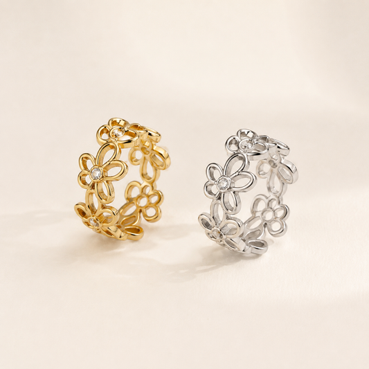 Gold and silver Zircon Flower Ring collection on luxury ivory background