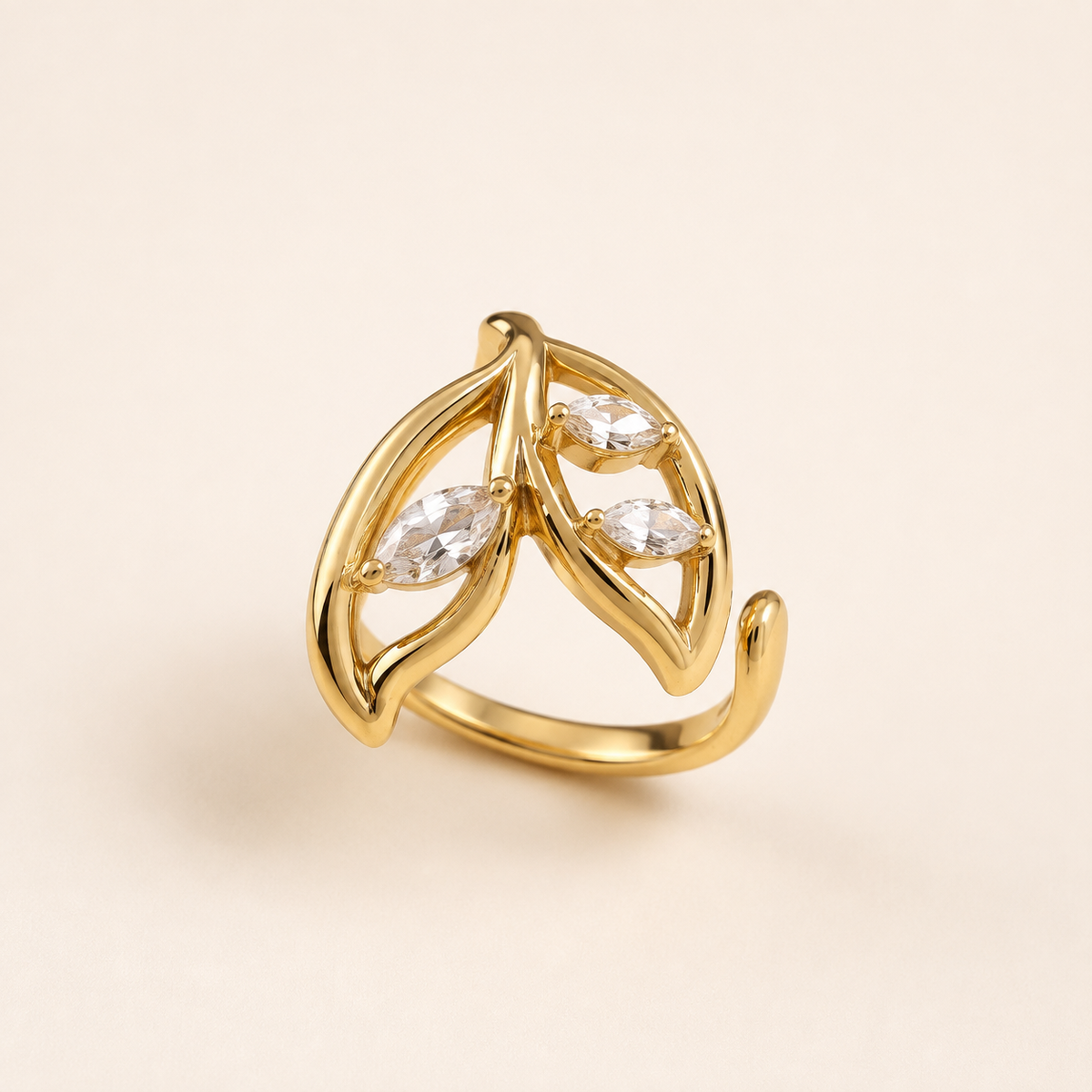 Gold Zircon Wrap Ring with double-leaf design on luxury ivory background